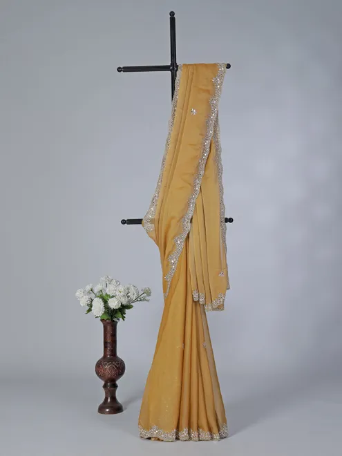 Gold shimmer tissue silk saree with heavy embellishments