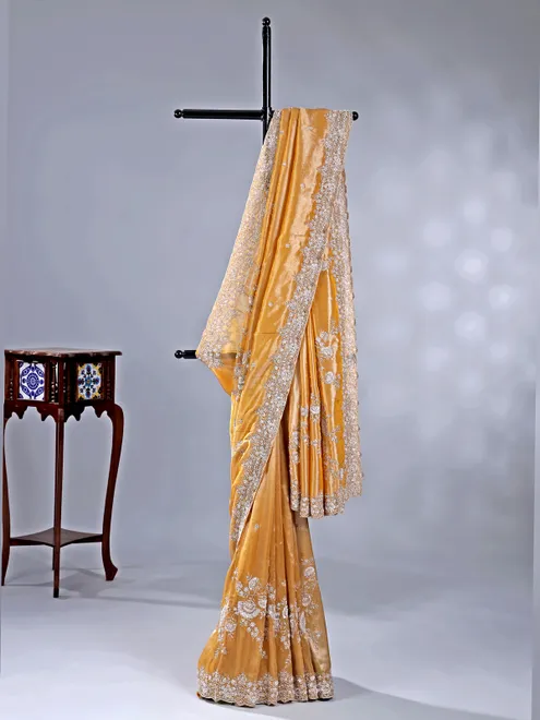 Gold silk saree with haldi perfect finish