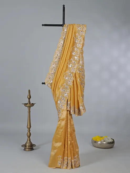 Golden tissue silk saree with diamond embellishments