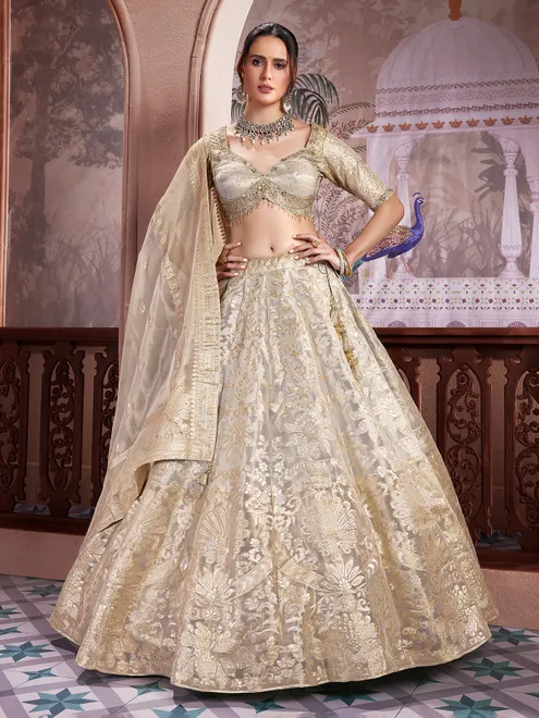Golden tissue silk sweetheart neck lehenga choli ensemble