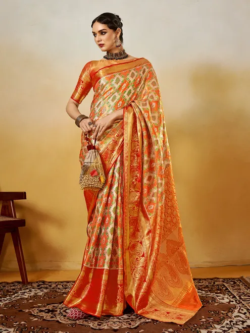 Graceful orange silk saree with zari weaving elegance