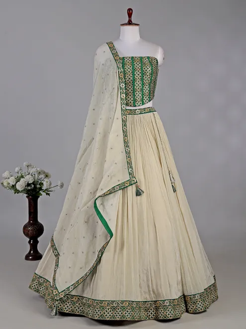 Green and cream silk lehenga choli with resham detailing