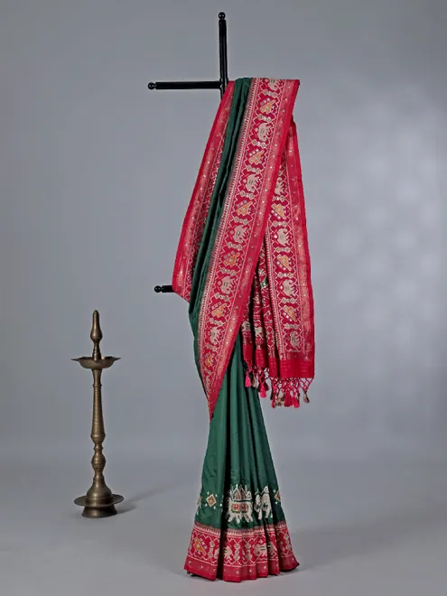 Green patola silk saree with pearls detailing