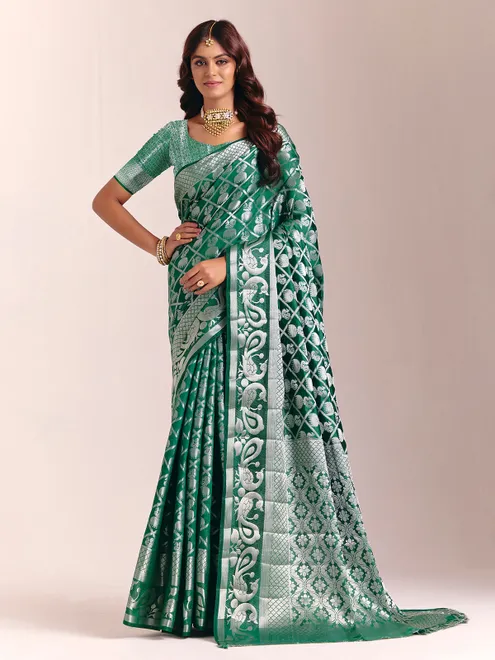 Green silk saree featuring traditional zari detailing