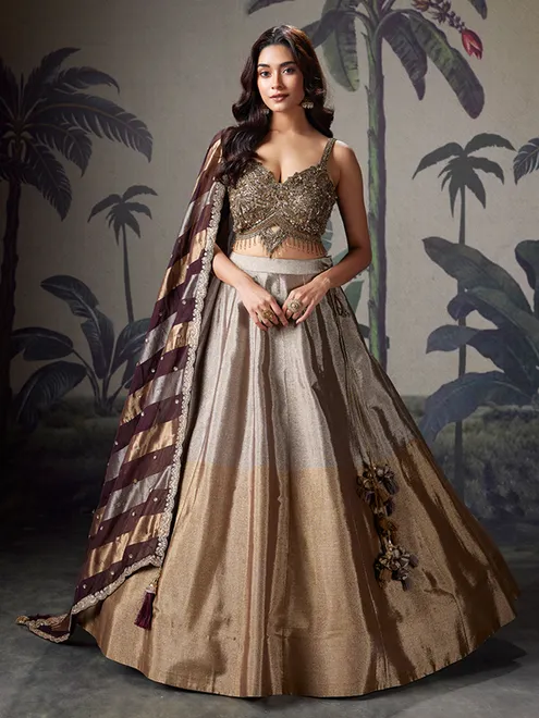 Grey and gold silk wedding wear lehenga with rich embellished choli