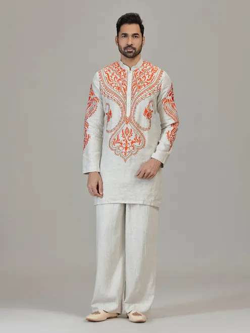 Ivory orange embroidered contemporary celebration look