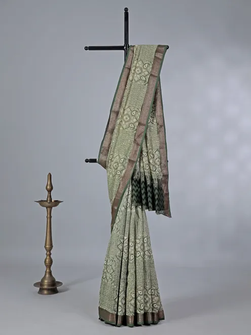 Light green cotton saree with mirror ornamentation