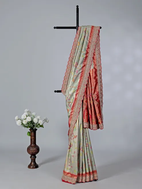 Light grey kanjivaram silk saree with colorful motifs
