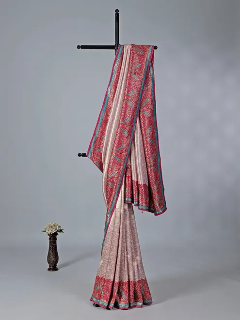 Light pink tissue silk saree with colorful motifs