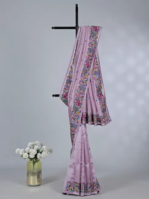 Light purple tissue saree with festive detailing