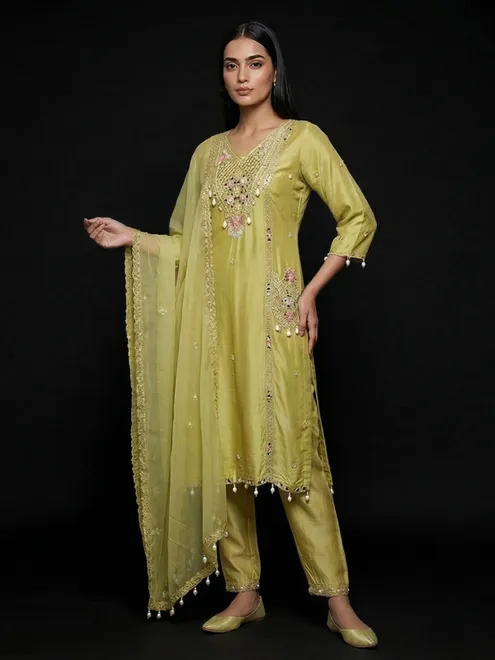 Mehendi yellow silk cowrie shells embellished festive salwar suit