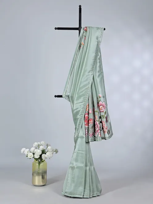 Mint green tissue saree with festive embroidery