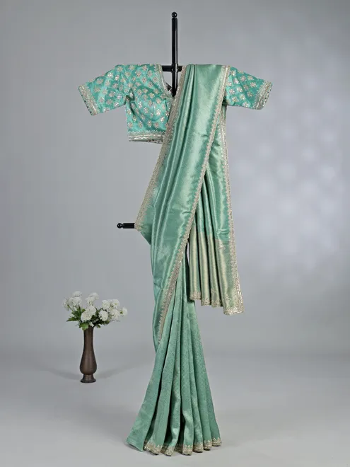 Mint green tusser dola silk saree with heavy work