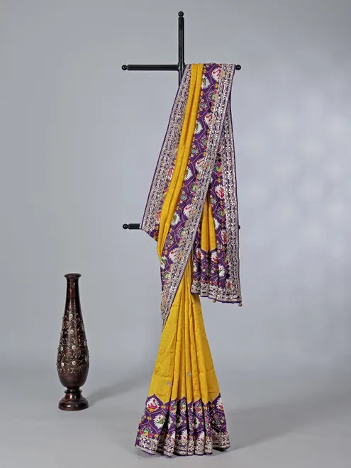 Mustard yellow and purple patola silk saree