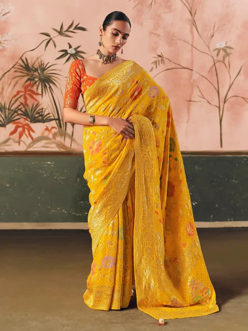Mustard yellow bandhej zari woven georgette saree
