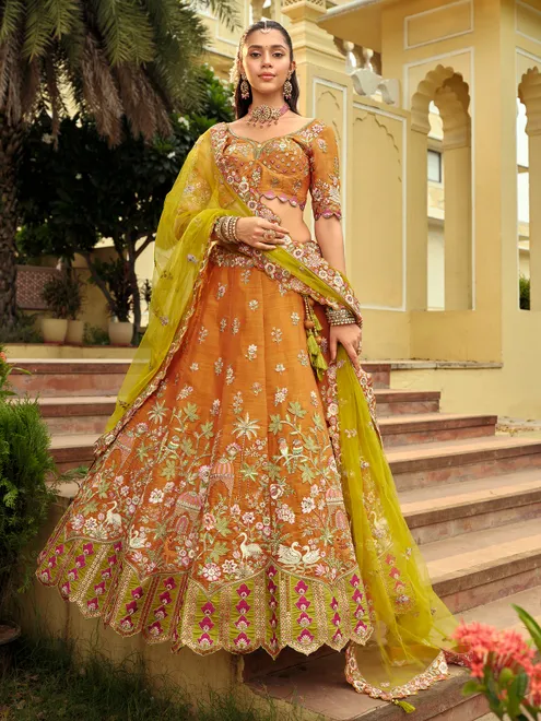 Mustard yellow classic artisan silk lehenga choli for haldi celebration