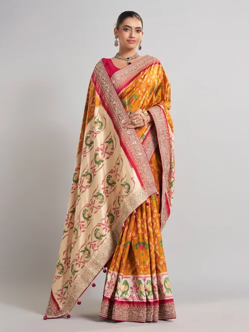 Mustard yellow patola silk saree for haldi ceremonies