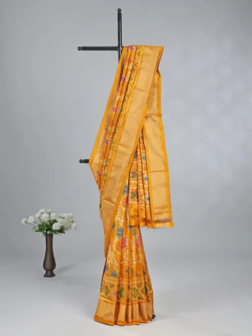 Mustard yellow patola silk saree for haldi glow