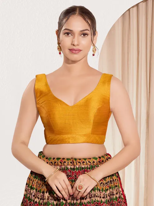 Mustard yellow silk u neck sleeveless festive blouse