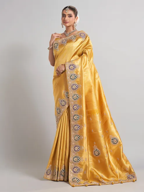 Mustard yellow tissue silk saree with rich embellished work