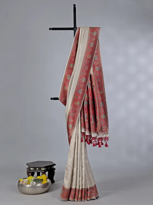 Off white dola silk saree with colorful motifs