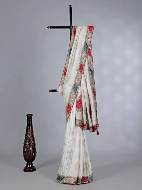 Off white dola silk saree with stone and thread embellishments