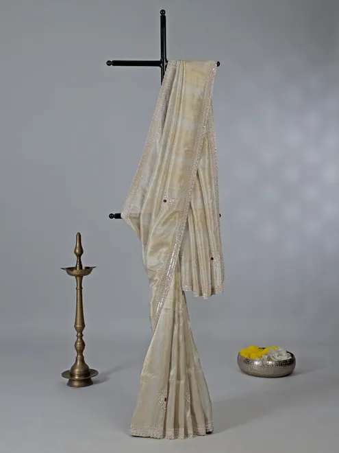 Off white dola tissue silk saree with zari work