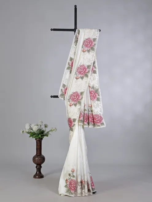 Off white floral art tusser silk saree with embroidered accents