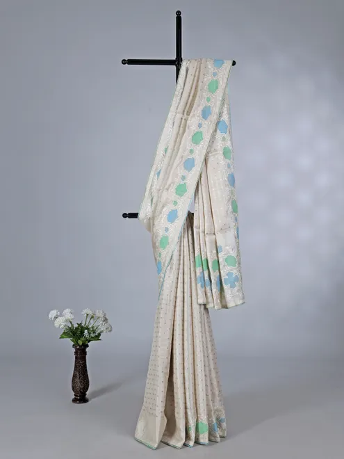 Off white semi silk saree with elegant zari and embroidery work