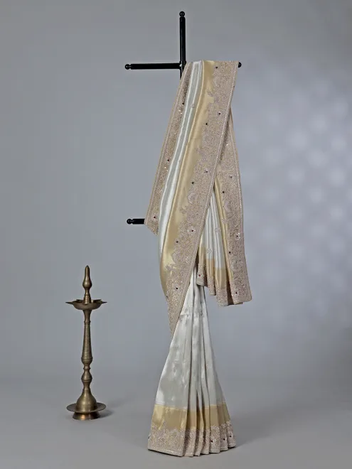 Off white ziraf silk saree with heavy border