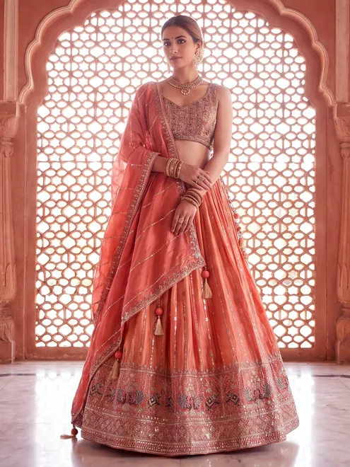 Orange designer banarasi silk lehenga choli for wedding wear