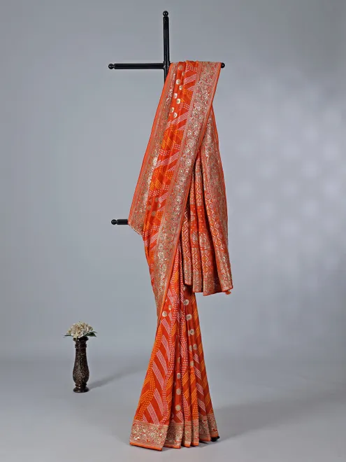 Orange dola silk saree with bandhej print