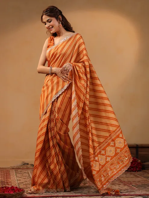Orange printed silk saree with aabla accents