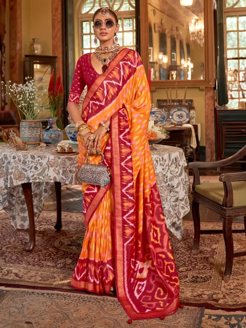 Orange printed silk saree with maroon pallu