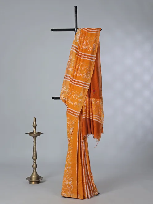 Orange printed tusser silk saree with thread work