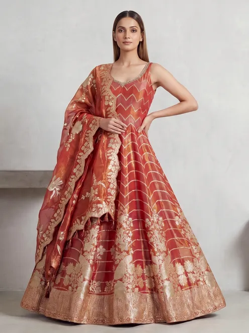 Orange silk anarkali suit with peacock design