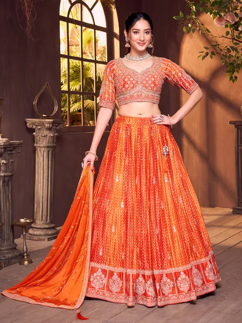 Orange silk bandhej elbow sleeve lehenga choli