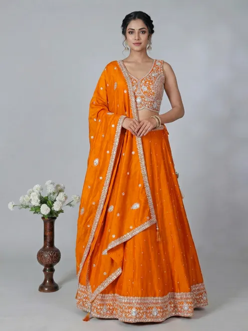 Orange silk embroidered lehenga choli with dupatta