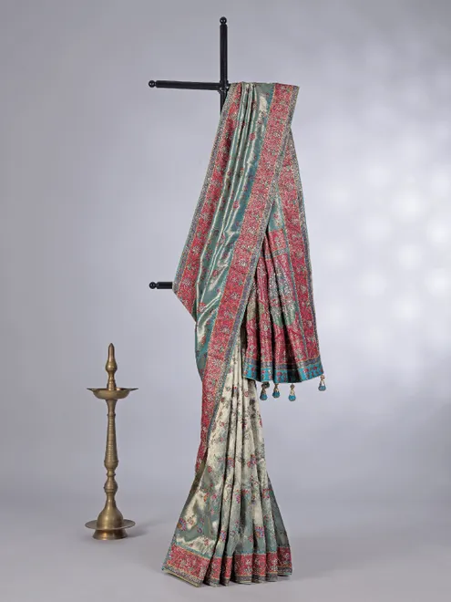 Pastel aqua tissue silk contrast border heavy work saree