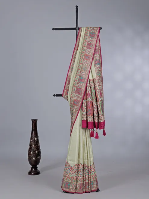 Pastel cream pashmina silk saree with artistic borders