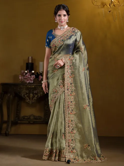 Pastel green organza saree with zardosi embroidery