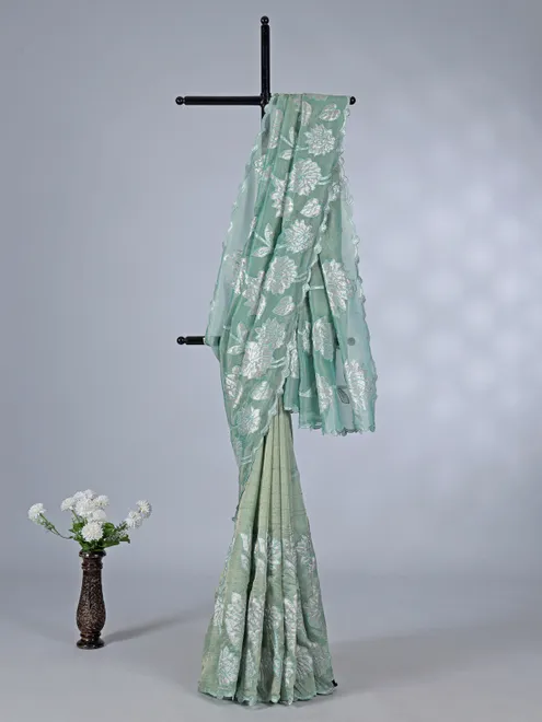 Pastel green semi tissue silk saree with elegant zari work