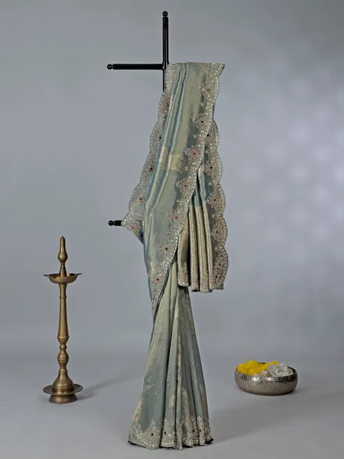 Pastel green tissue silk saree with diamond work