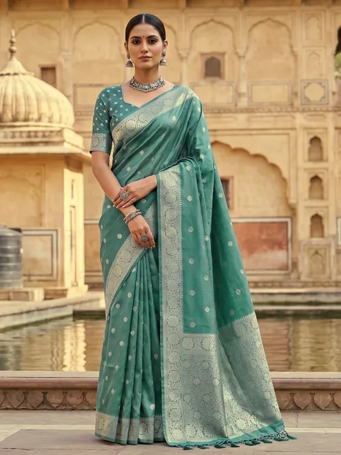 Pastel green tissue silk saree with elegant woven butti design