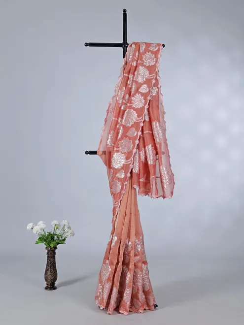 Pastel orange semi tissue silk saree with zari design