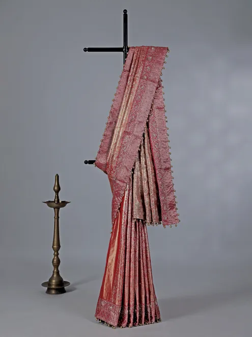 Peach kanjivaram silk saree with regal zardosi craft