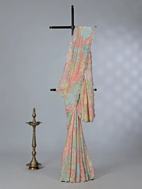 Peach printed crepe silk saree with mirror work