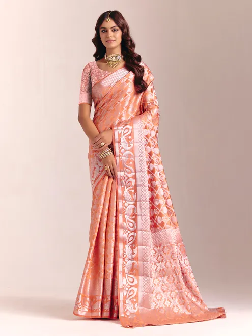 Peach silk saree accented with classic zari work