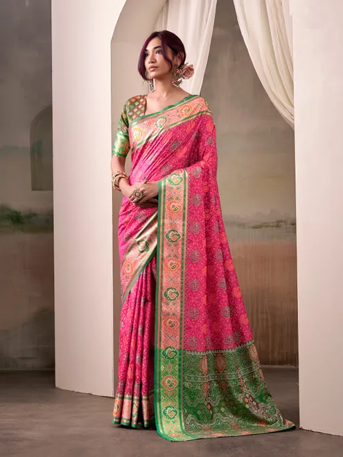 Pink patola silk saree with dark green blouse