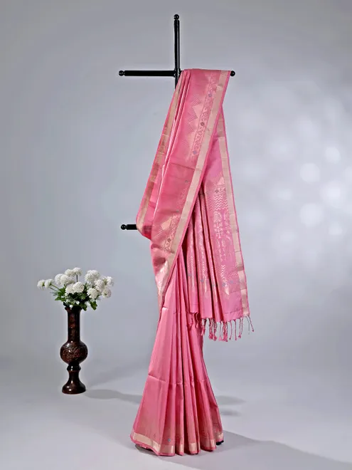 Pink silk saree with gleaming zari accents